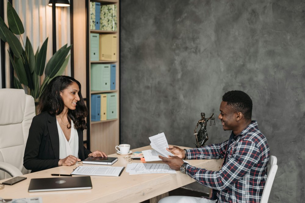 lawyer discussing with a client at her office